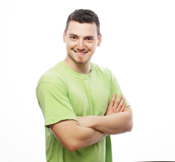 istock happy young man in green t-shirt 1406283865