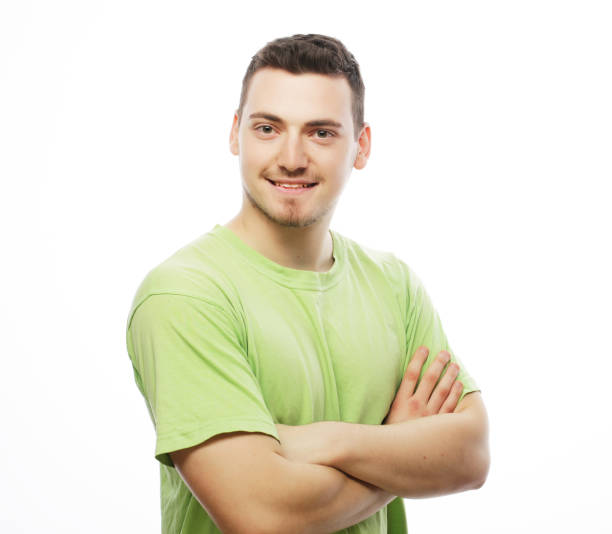 istock happy young man in green t-shirt 1406283885