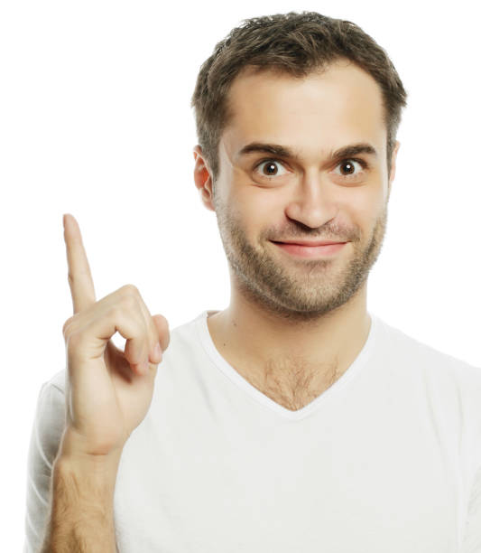 istock Young smiling happy man shows something 1406283895