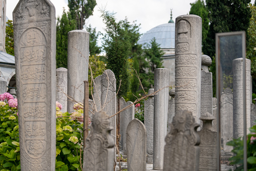 Gravestones belonging to the tombs in the mosque.\nPhotographed in Fatih district in Istanbul