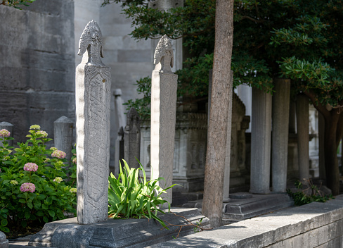 Gravestones belonging to the tombs in the mosque.\nPhotographed in Fatih district in Istanbul