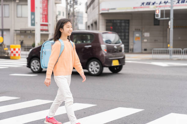 istock asian elementary school girl , school bag 1406286284