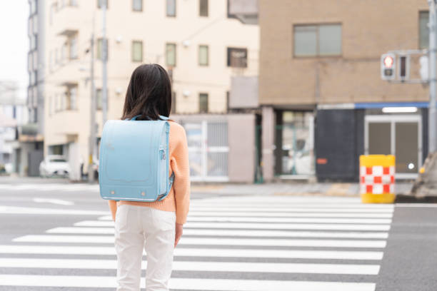 istock asian elementary school girl , school bag , back 1406286318