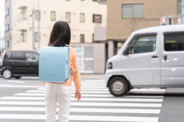 istock asian elementary school girl , school bag , back 1406286380