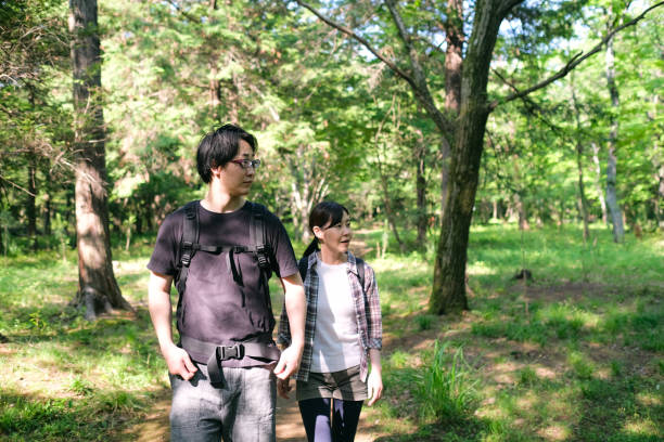 istock Couple hiking in forest 1406287377
