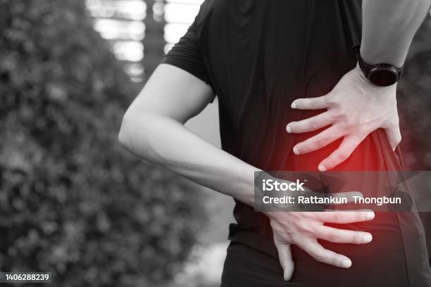 Lower Back Pain Is Usually Caused By A Muscle Injury Broken Pillow Stock Photo - Download Image Now