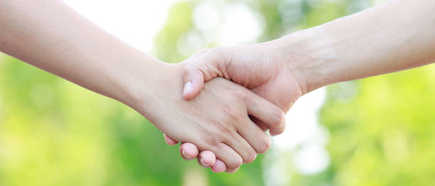 istock Closeup of a business hand shake between two colleagues 1406288241