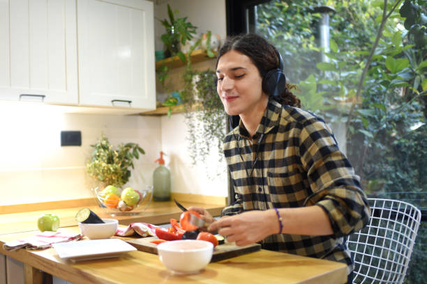 istock young man cooking healthy food 1406289274