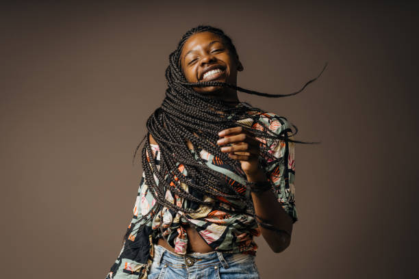 istock Happy black woman rocking her braids 1406290059