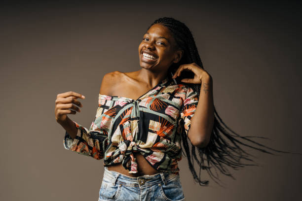 istock Happy black woman rocking her braids 1406290065