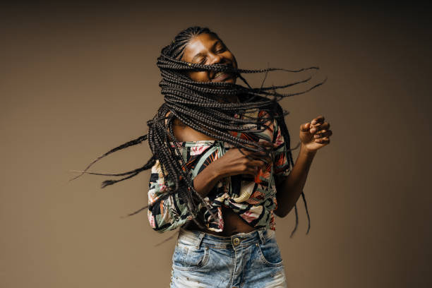 istock Happy black woman rocking her braids 1406290066