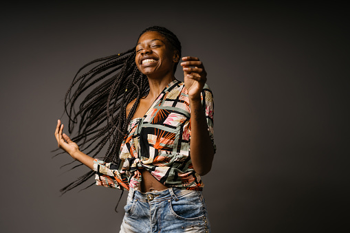 Happy black woman rocking her braids