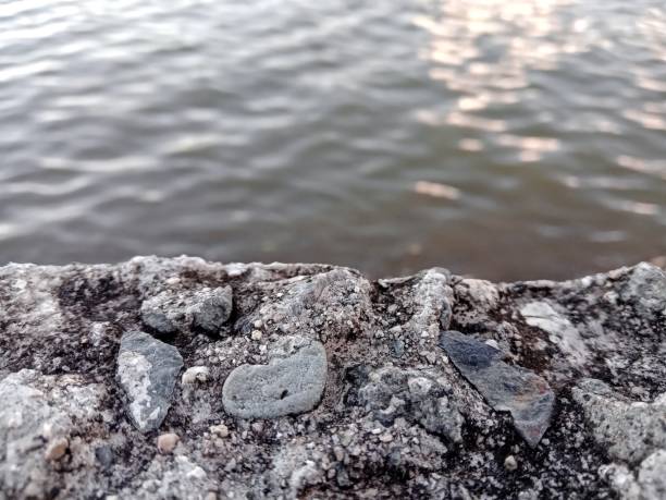 View of the defocused transition of seawater with concrete in focus