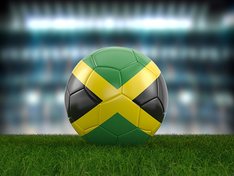 Soccer ball Jamaica flag on a soccer pitch. 3d illustration.