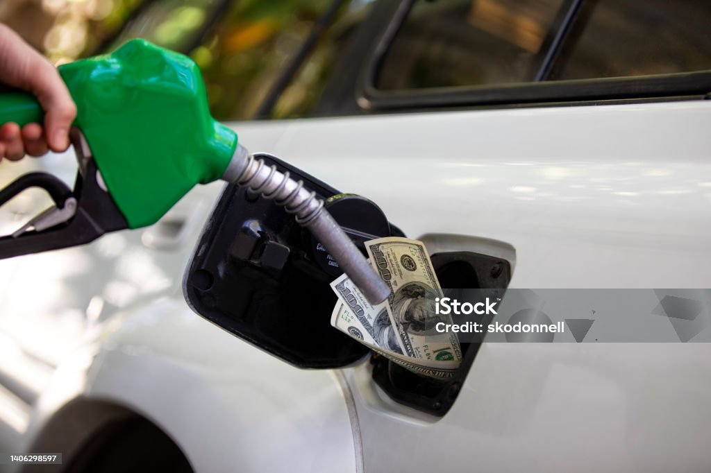 Gas Prices Increasing at the Pump Station Gas sign showing inflation and economic impact at the gas pump. 2022 Stock Photo