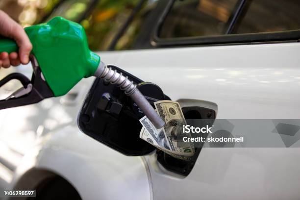 Gas Prices Increasing At The Pump Station Stock Photo - Download Image Now - 2022, American One Dollar Bill, Bad News