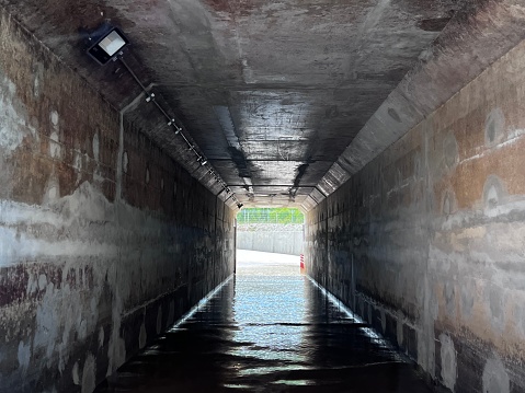 Small tunnel with water flood on the floor
