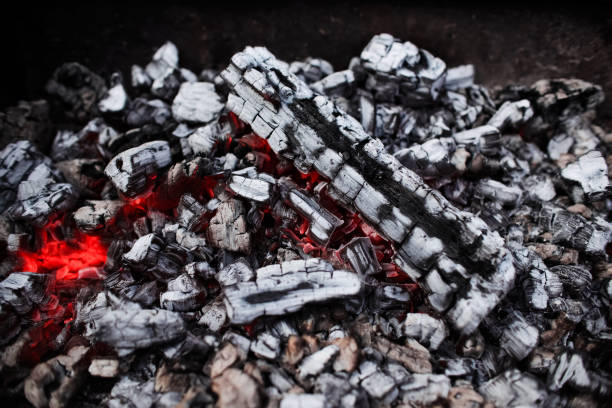 Hot coals texture, close-up. BBQ grill embers, top view