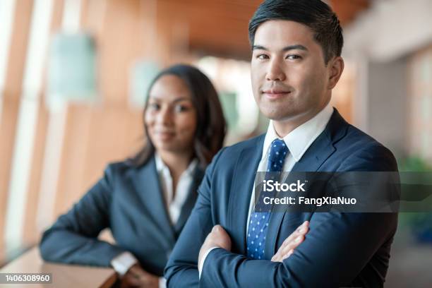 Portrait Of Pacific Islander Mid Adult Businessman With Multiracial Female Black Coworker In Office Stock Photo - Download Image Now