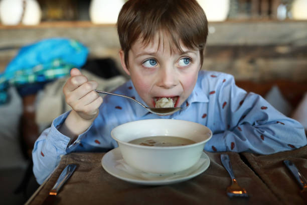 istock Child eating dumplings with broth 1406311455