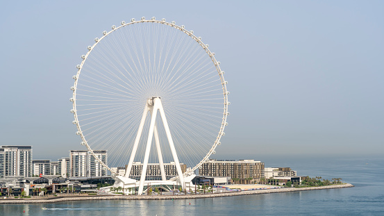 Dubai, United Arab Emirates. Amazing aerial view of the Ain Dubai and the Bluewaters Island. The world’s tallest and largest observation wheel. An iconic landmark close to Dubai Marina