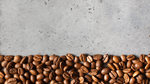 istock Background of roasted coffee beans full frame. Coffee-themed banner. Copy space 1406314076