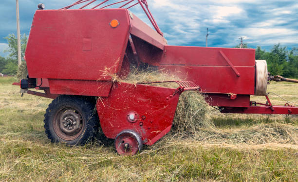 istock Hay collection. Pressing and pressing hay bales with a baler 1406315260