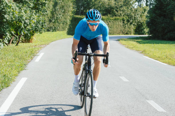 istock Male athlete riding a racing cycle 1406319600