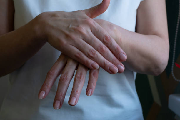 istock woman uses handcream 1406320760