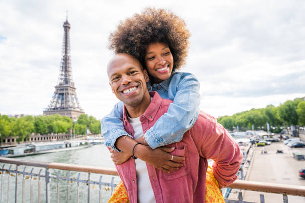 istock Afro-american beautiful couple in love visiting Paris 1406321079