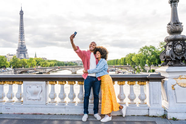 istock Afro-american beautiful couple in love visiting Paris 1406321724