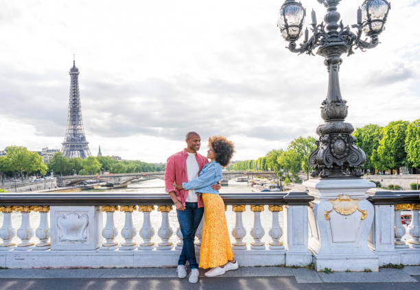 istock Afro-american beautiful couple in love visiting Paris 1406321899