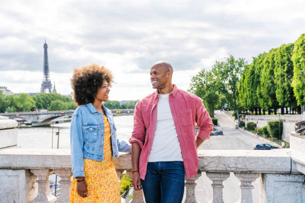 istock Afro-american beautiful couple in love visiting Paris 1406322416