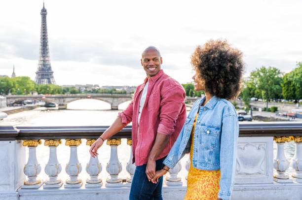 istock Afro-american beautiful couple in love visiting Paris 1406322497