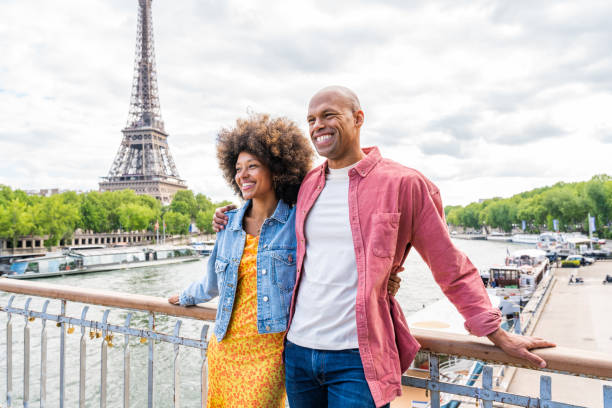 istock Afro-american beautiful couple in love visiting Paris 1406322557