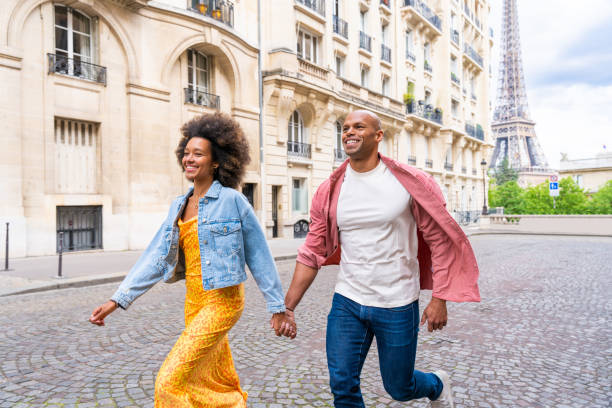 istock Afro-american beautiful couple in love visiting Paris 1406322743