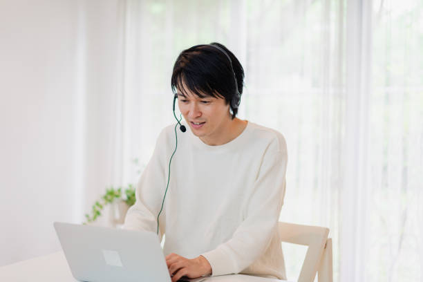 istock A father participating in a remote meeting 1406322995