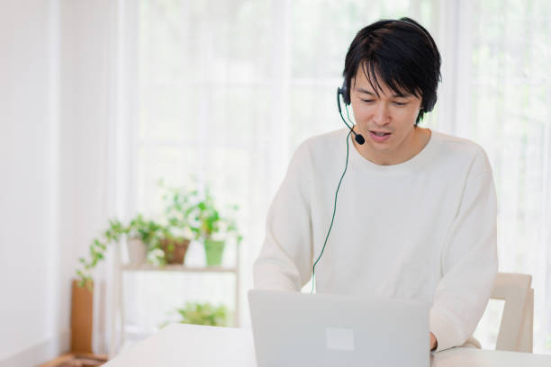 istock A father participating in a remote meeting 1406323008