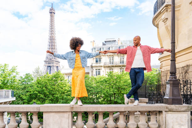 istock Afro-american beautiful couple in love visiting Paris 1406323019