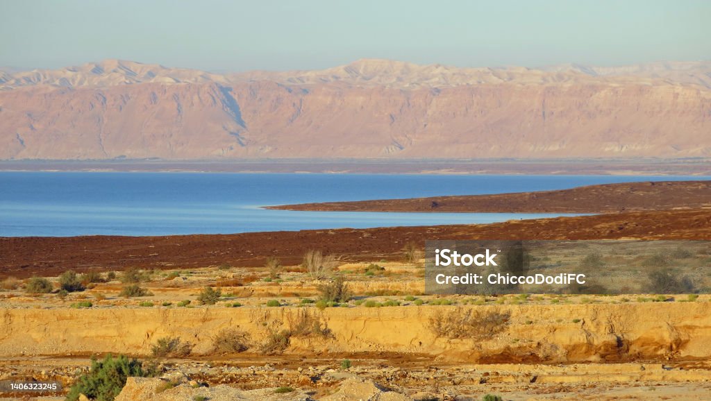 panorama of the Dead Sea of azure color with the mountains in the background and the desert in the foreground Enchanting panorama of the Dead Sea of azure color with the mountains in the background and the desert in the foreground Asia Stock Photo