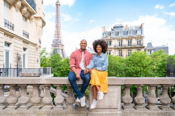 istock Afro-american beautiful couple in love visiting Paris 1406323929