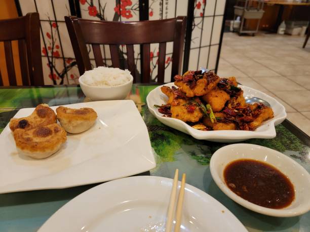 istock hot and spicy Chinese fried fish with peppers and dumplings 1406324047