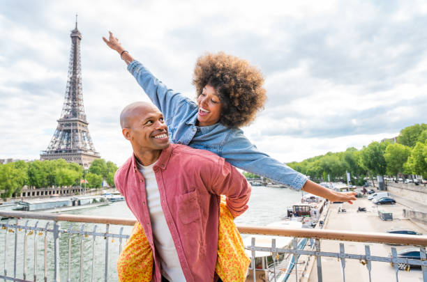 istock Afro-american beautiful couple in love visiting Paris 1406324220