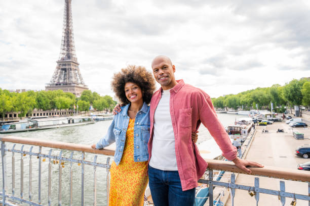istock Afro-american beautiful couple in love visiting Paris 1406324290