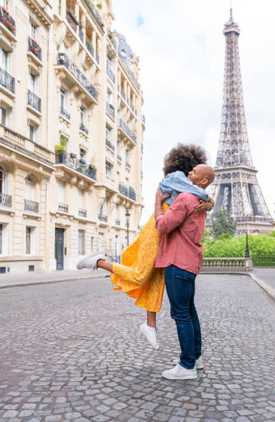 istock Afro-american beautiful couple in love visiting Paris 1406324433