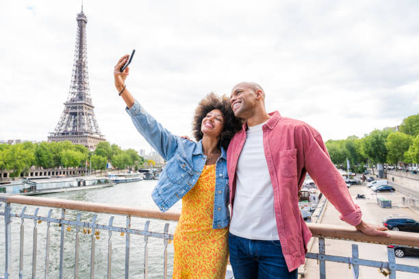 istock Afro-american beautiful couple in love visiting Paris 1406324630