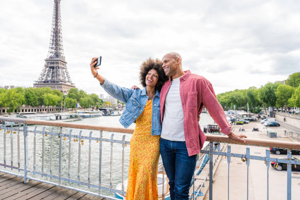 istock Afro-american beautiful couple in love visiting Paris 1406324662