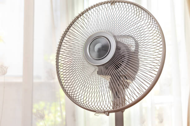 istock Electric fan by the window 1406325159