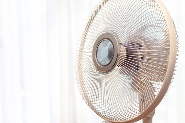 istock Electric fan by the window 1406325194