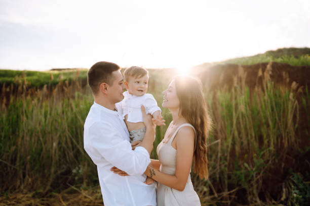 istock Cute  family are having fun on the beach. 1406325253